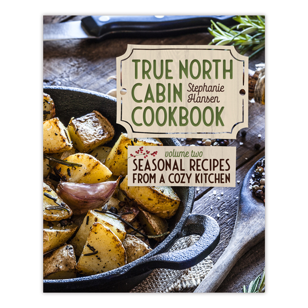book cover with title and image of food in a skillet